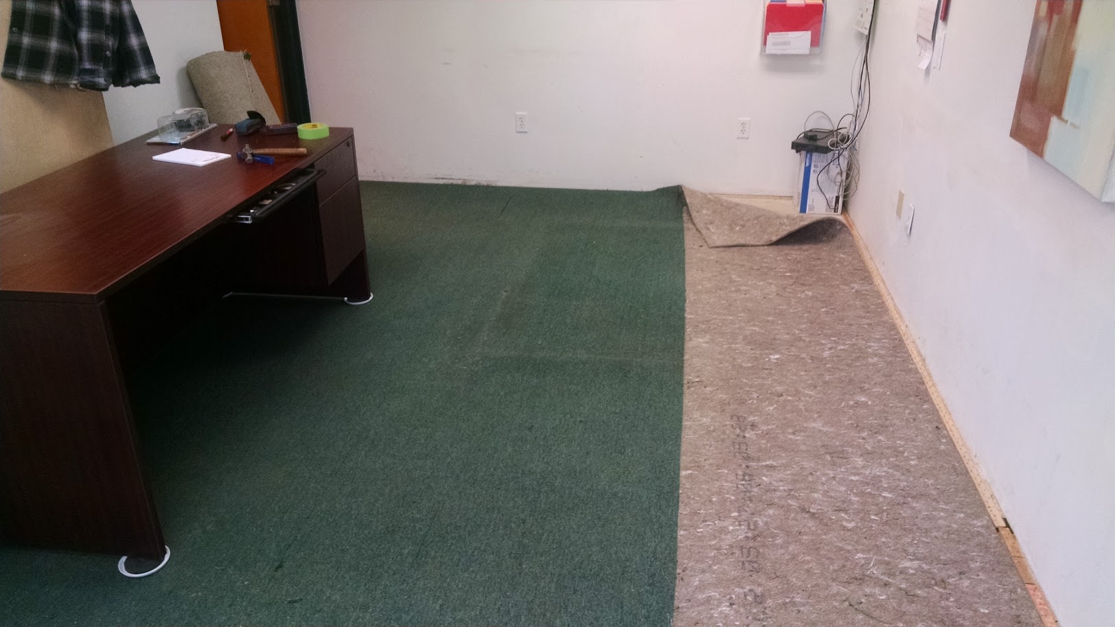 Penn Hills office floor — carpet removal begins