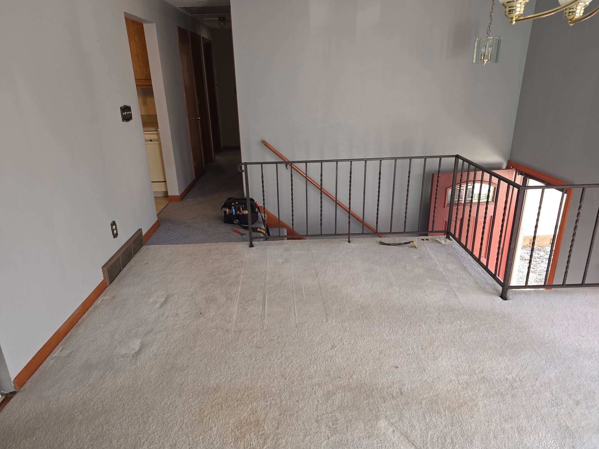 Room before — old carpet and iron railing